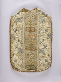 Chasuble. Chasuble with a column embroidered with colored silk with large, convex flowers on a