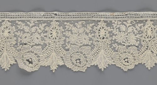 Lace fragment, lace with plant ornaments. Serrated on one side, with a pattern of flowers,