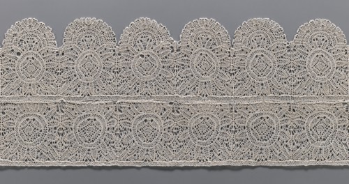 Lace fragment, bobbin lace, two pieces sewn together across their width: one with straight edges,