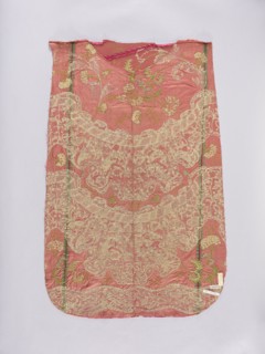 Back of a chasuble. Fragment of red amaranth satin fabric, embroidered; originally probably