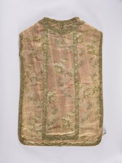 Chasuble, liturgical vestment; large floral pattern and lace motif set against a raspberry