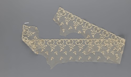 Fragment of lace, lace with plant ornaments, slightly serrated lower edge with shell motifs with