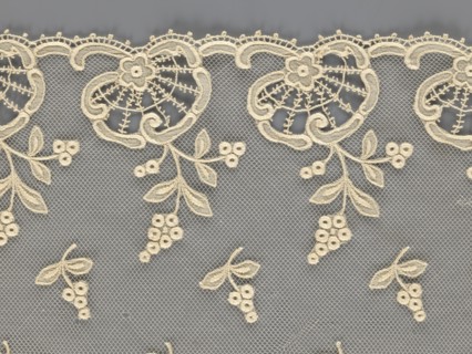Fragment of lace, lace with plant ornaments, slightly serrated lower edge, featuring shell motifs