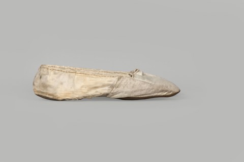 Flat women's slippers of white satin, top edge finished with ribbon. Flat-cut toes, symmetrical