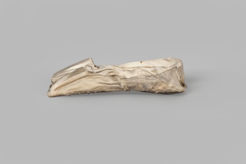 Flat women's slippers of white satin. Flat-cut toe, symmetrical soles of thin leather. The endpaper