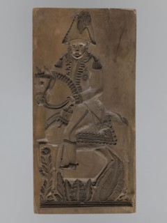 Gingerbread mold, double-sided. Obverse: image of a rider on a horse in a parade uniform from the