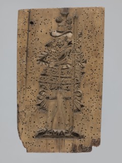A single-sided gingerbread mold of rectangular shape with the image of a male figure in a richly