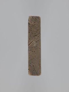 A single-sided gingerbread mold of rectangular shape with the image of a male figure in a richly