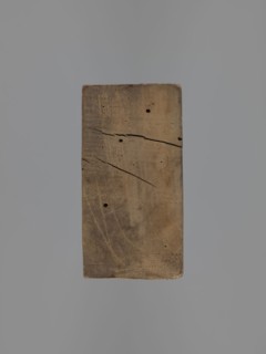 Double-sided gingerbread mold. Obverse: baby in swaddling clothes richly decorated with various