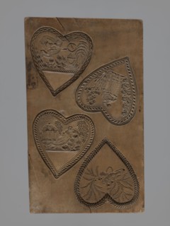 Double-sided gingerbread mould. Obverse: two heart-shaped fields — first: female figure in a long