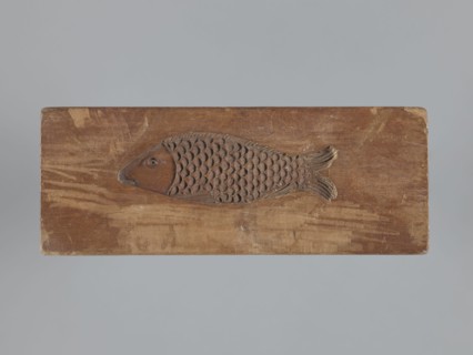 Double-sided gingerbread mould. Obverse: female figure in a long, patterned, richly decorated