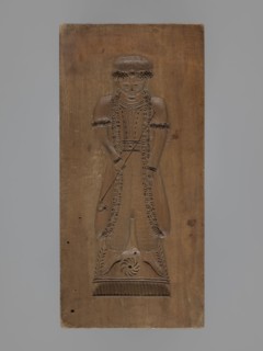 Double-sided gingerbread mould. Obverse: female figure in a long, patterned, richly decorated