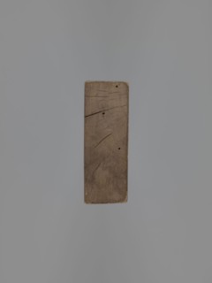 Double-sided gingerbread mould. Obverse: female figure in a long, patterned, richly decorated