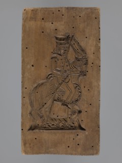 Double-sided gingerbread mould with the image of a rider on both sides, gingerbread; subject: