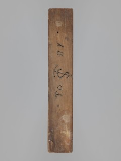 Double-sided gingerbread mold. Obverse: couple holding hands — a woman in a richly decorated long