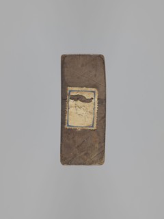 Double-sided gingerbread mold. Obverse: couple holding hands — a woman in a richly decorated long