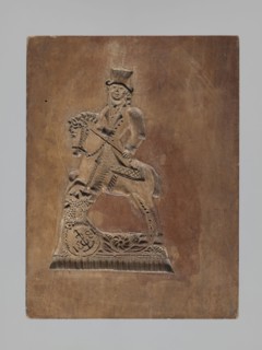 Double-sided gingerbread mould. Rectangular wooden form; obverse: image of a lion with abundant