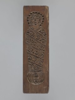Double-sided gingerbread mold — obverse: female figure; reverse: baby in swaddling clothes.