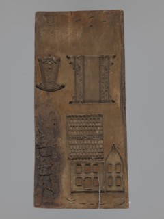 Double-sided gingerbread mould. Obverse: figure of a bearded man in patterned clothes, richly