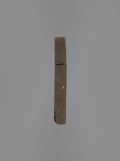 Double-sided gingerbread mould. Obverse: figure of a bearded man in patterned clothes, richly