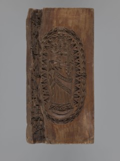 Double-sided gingerbread mould. Obverse: Madonna and Child with a crown, in a long patterned dress,