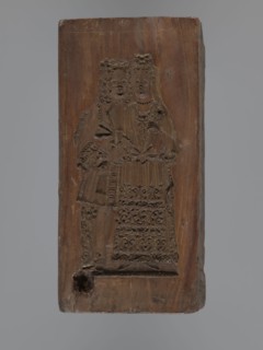 Double-sided gingerbread mould. Obverse: Madonna and Child with a crown, in a long patterned dress,