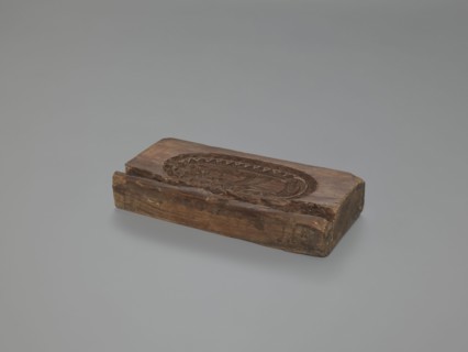 Double-sided gingerbread mould. Obverse: Madonna and Child—Madonna wearing a crown, in a long