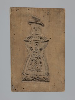 Double-sided gingerbread mold; obverse: female figure; reverse: four images baby in swaddling