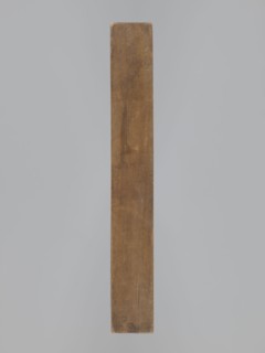 One-sided gingerbread form with the image of a rectangular floral and plant ornament. One-sided