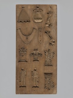 Double-sided gingerbread mould. Obverse: 16 images of various figures; reverse: 12 depictions.