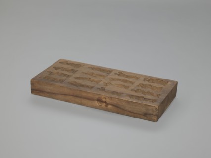 Double-sided gingerbread mould. Obverse: 16 images of various figures; reverse: 12 depictions.