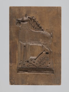 Double-sided gingerbread mould. Rectangular shape; obverse: stylised horse in full trot with a
