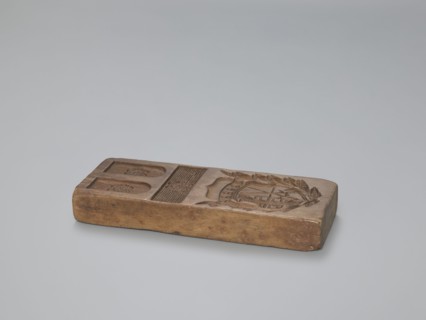 Double-sided gingerbread form. Obverse: heraldic shield. Reverse: plant ornament. Double-sided
