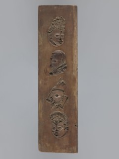 Double-sided gingerbread mould. Obverse: images of four heads; on rotation heads take on male or