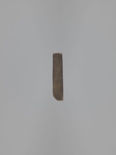 Double-sided gingerbread mould. Obverse: images of four heads that, depending on rotation of the