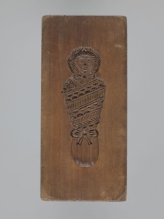 Double-sided gingerbread mold. Obverse: baby in swaddling; Reverse: baby in swaddling. Folk-style