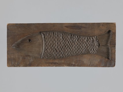 Double-sided gingerbread form. Obverse: male figure in a hussar uniform; reverse: fish.