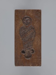 Double-sided gingerbread form. Side A: female figure; Side B: baby in swaddling clothes. Maker
