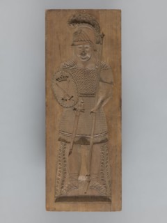Double-sided gingerbread form; obverse: female figure in a helmet; reverse: male figure in a helmet