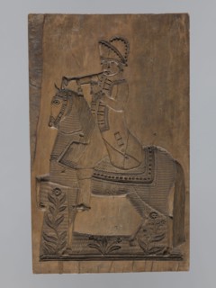 Double-sided gingerbread form. Obverse: image of a rider; reverse: four representations of human