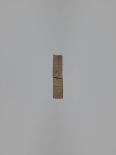 Double-sided gingerbread mold. Obverse: baby in swaddling clothes richly decorated with geometric