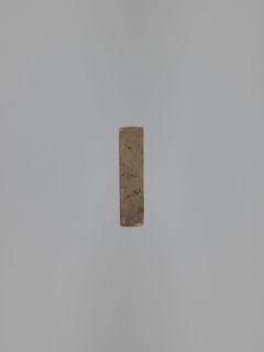 Double-sided gingerbread mold. Obverse: baby in swaddling clothes richly decorated with geometric