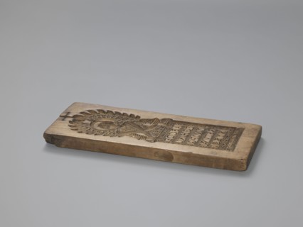 Double-sided gingerbread form. Obverse: figure of an angel with the alphabet. Reverse: various