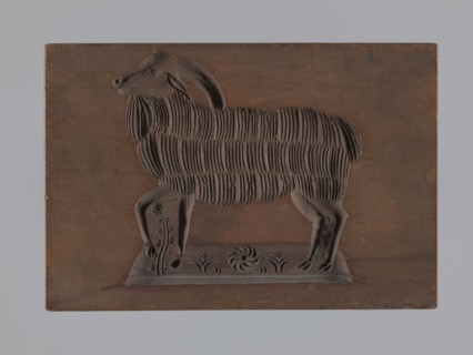 Double-sided gingerbread form; rectangular shape. One side: image of a grazing sheep in a meadow.
