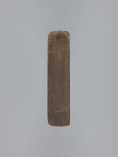 Double-sided gingerbread mould. Obverse: vase with flowers within an oval frame surrounded by a