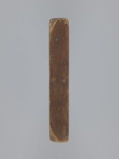 Double-sided gingerbread mould. Obverse: oval frame with a decorative vase of flowers surrounded by
