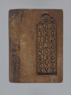 Double-sided gingerbread mould. Obverse: board with letters of the alphabet; reverse: image of a