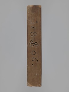 Double-sided gingerbread mould. Obverse: board with letters of the alphabet carved on it. Reverse: