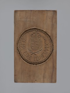 Double-sided gingerbread mould. Obverse: rectangular mould with an oval coat of arms in a