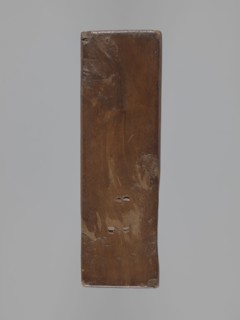 Double-sided gingerbread mould; obverse: stylised elongated fish covered with scales, shown in